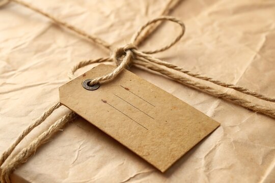 Wrapped package with tag and string for gift giving or small business