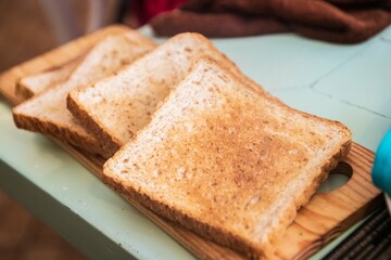 Freshly Toasted Bread on Wooden Board