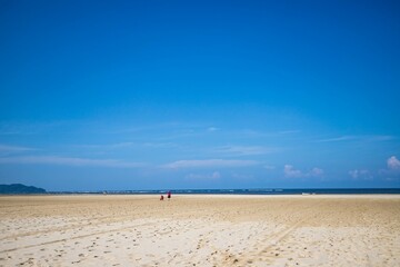 Tranquil Beach Walk Under Clear Skies, Sabah, Malaysia