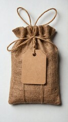Brown Burlap Pouch with Kraft Tag and String Tie on White Background