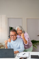 Happy Excited Senior Spouses Celebrating Success With Laptop At Home, Cheerful Older Husband And...
