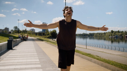 Happy Caucasian man male guy sport sportsman athlete running runner jogger city energy enjoying...