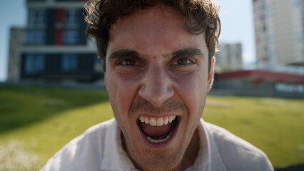 Close up angry Caucasian man male mad shouting at camera guy screaming stress city negative...