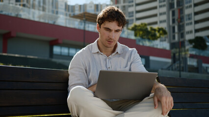 Caucasian thoughtful man thinking working laptop computer freelancer male guy businessman business...