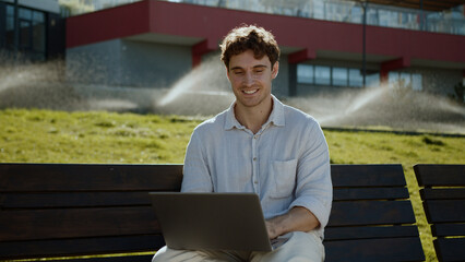 Happy Caucasian man using laptop computer pc programmer smile businessman technology distant work...