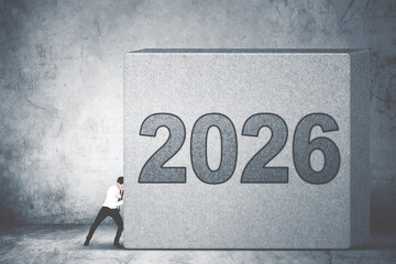 Businessman Pushing Heavy 2026 Block