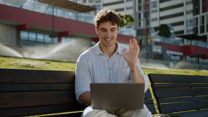 Caucasian man sitting talking conversation dialogue laptop computer online meet conference video...