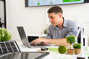 People in Modern corporate work on renewable energy to representing ESG Enviromental, Social,...