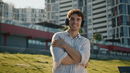 Handsome Caucasian man headphones earphones gadget device technology listening music sound male guy...