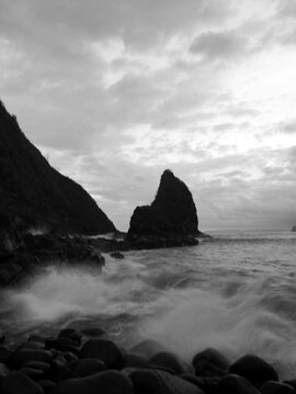Powerful coastal waves meet aquatic rock, capturing the wild spirit of Indonesia&rsquo;s southern shore.