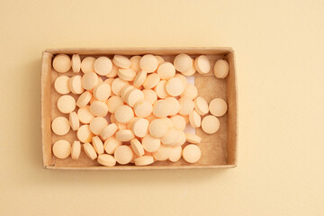 Minimal Health Concept – White and Peach Pills on Neutral Background for Pharmaceutical or Wellness Use
