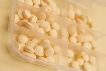 Minimal Health Concept – White and Peach Pills on Neutral Background for Pharmaceutical or Wellness Use