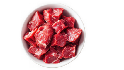 Overhead shot of a white bowl brimming with raw, cubed beef, showcasing its texture