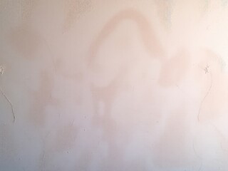 Fototapeta premium Abstract pastel textured wall exhibiting organic variations and subtle imperfections with a light gradient.