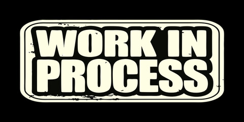 Vintage Style Work In Process Sign with Distressed Texture Creamy White Text on Black Background Showing Imperfection and Ongoing Development Retro Aesthetic