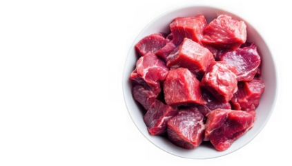 A white bowl overflowing with cut raw red beef cubes, isolated against a black background