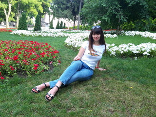 Woman lying in the park on the grass, tourism