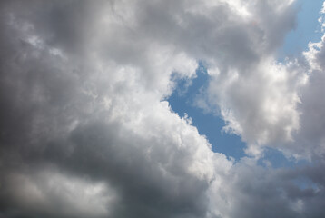The sky is cloudy and the sun is shining through the clouds