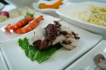 Assorted Seafood Platter with Octopus on White Plates