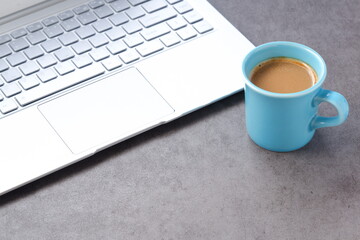 Laptop with cup of coffee
