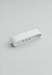 White rectangular band with three small holes in a studio setting. Blank product display against a neutral background. Design mockup for a tech product. Modern product photography.