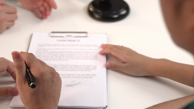 Couples legal file for divorcing by assistance from law firm to divide property after breakup. Obligations contract assist by lawyer in negotiating settlement agreement meeting. Slow motion. Rigid.