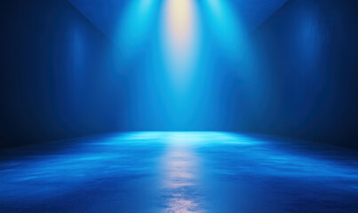 Obraz premium Blue illuminated stage with dramatic lighting and reflective floor surface.