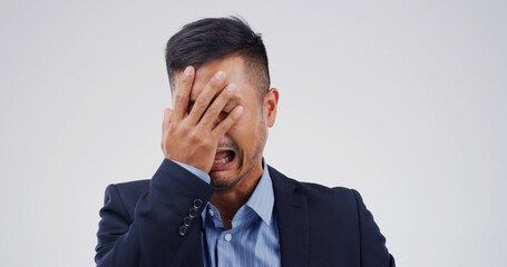 Crying, upset and businessman in studio with emotions for unemployment, burnout or mistake. Stress,...