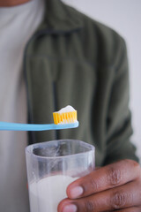 Brushing teeth with a toothbrush and soda power 