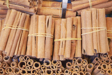 Bundles of cinnamon sticks at a market stall