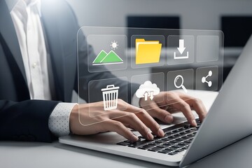 Businessman using laptop with digital file management interface icons symbolizing data storage and cloud computing