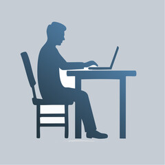 Silhouette of a focused man working on a laptop at a desk in an office