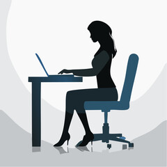 Silhouette of a woman working on a laptop at her desk in an office