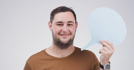 Portrait, happy man and speech bubble in studio for social media, faq or forum. Smile, person or...