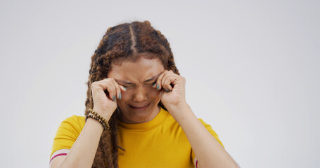 Crying, sad and stress with woman on studio space for reaction for bad news of grief, loss or pain....