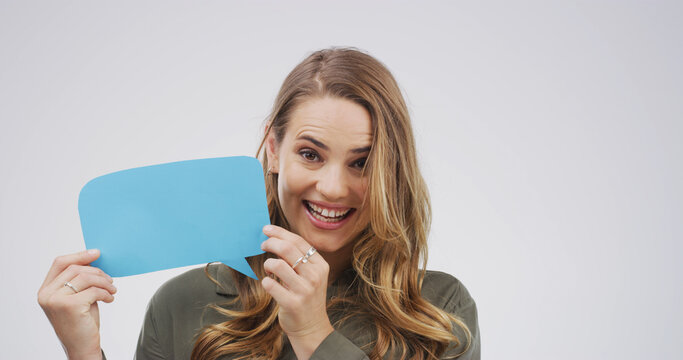 Portrait, speech bubble and woman in studio, excited and announcement on white background. Mockup, social media and person with branding space, opinion and review with feedback, opportunity or poster