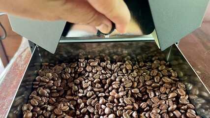Close-up coffee beans in a coffee machine