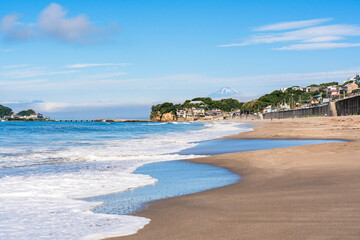 Stunning view of Kamakura Beach with Mount Fuji rising in the background, in Kanagawa Prefecture, Japan.