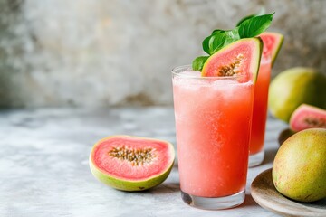 Pink guava juice drink garnished with basil leaves.