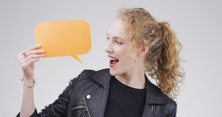 Happy, speech bubble and woman in studio, feedback and announcement on white background. Smile,...