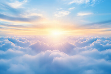 A breathtaking sunrise above fluffy clouds with soft rays of sunlight illuminating the sky in warm hues.