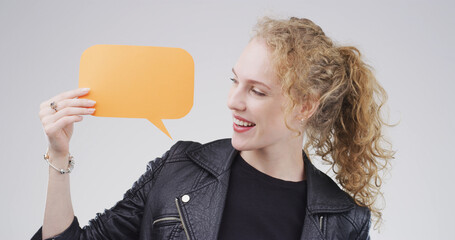 Smile, woman and speech bubble with announcement in studio for sale, promo deal and coming soon....