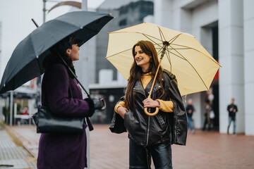 A moment capturing women conversing under umbrellas amid the rainy cityscape, showcasing connection...