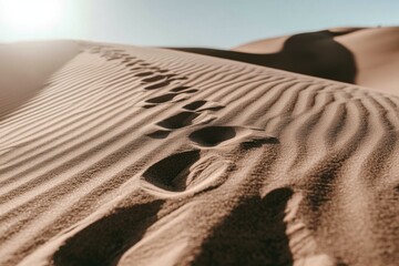 Minimalist footprints in desert sand under sunlight for tranquil nature design