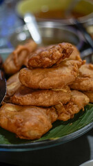 Stack of Indonesian Fried Banana (Pisang Goreng) on Banana Leaf – Traditional Snack Close-Up