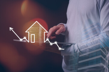 real estate investment concept man hand using tablet working on real estate growth graph property...