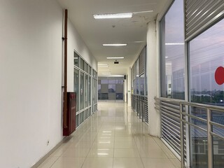 Jakarta, June 20, 2025. Background of the area inside the station with the ticket counter, the station entrance gate and the public in the background. Blurred
