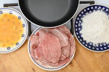 Dinner preparation, breaded pork chops, ingredients, top view