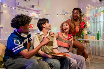 Group of diverse Generation Z friends enjoying a party in cozy house. 