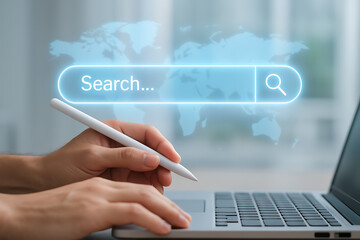 Futuristic global search interface on laptop with user using pen stylus to input text and explore internet technology tools and digital innovation resources